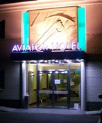 Entrance to Aviator Hotel accommodation at night