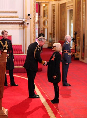 Bh receiving OBE from Charles