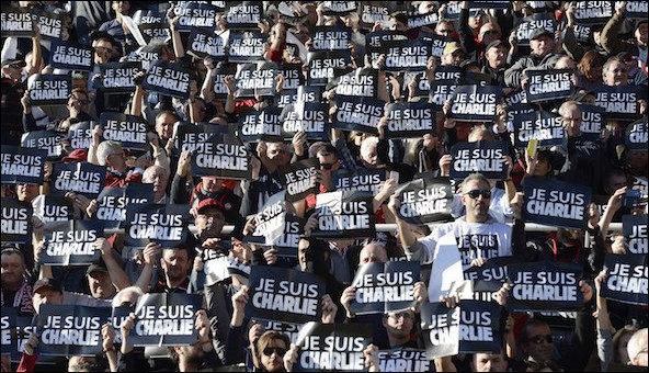 Crowd holding Je Suis Charlie posters