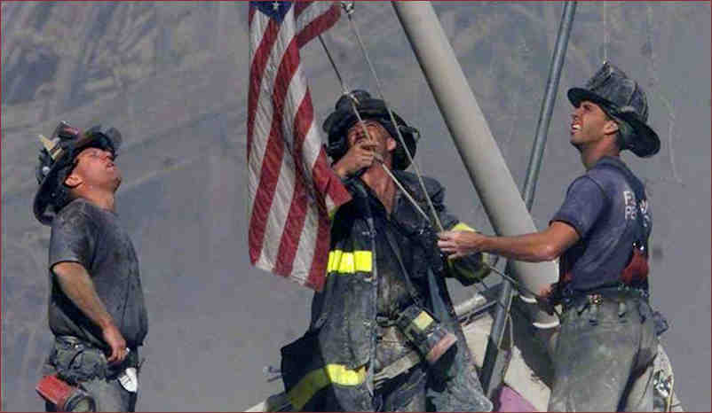 Firemen raising the flag at the site of 9/11