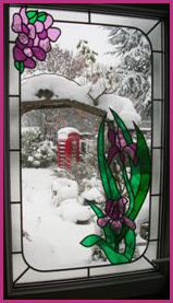Kiosk and Snow Scene through frame