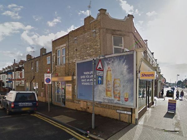 Original hoarding covering the sign