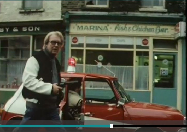 Eric Morecambe walking the Mini