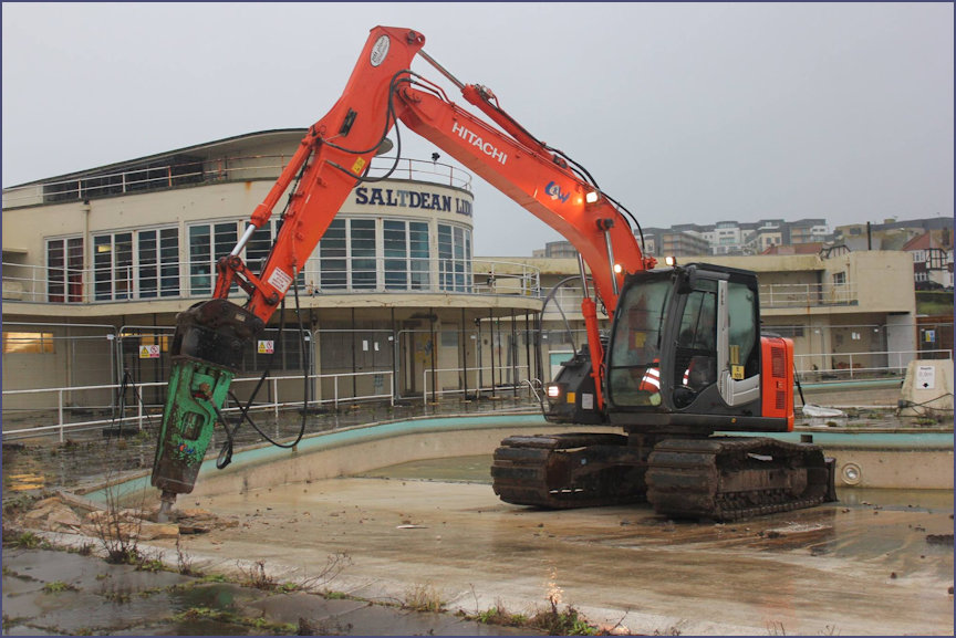 Digger in place to rip out the old swimming area