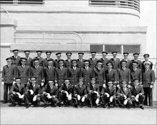Staff pose in front of the Pan Pacific