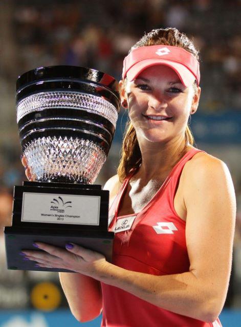 Aga holds trophy aloft