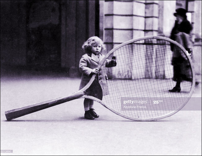 A Giant Tennis Racket for a very small girl