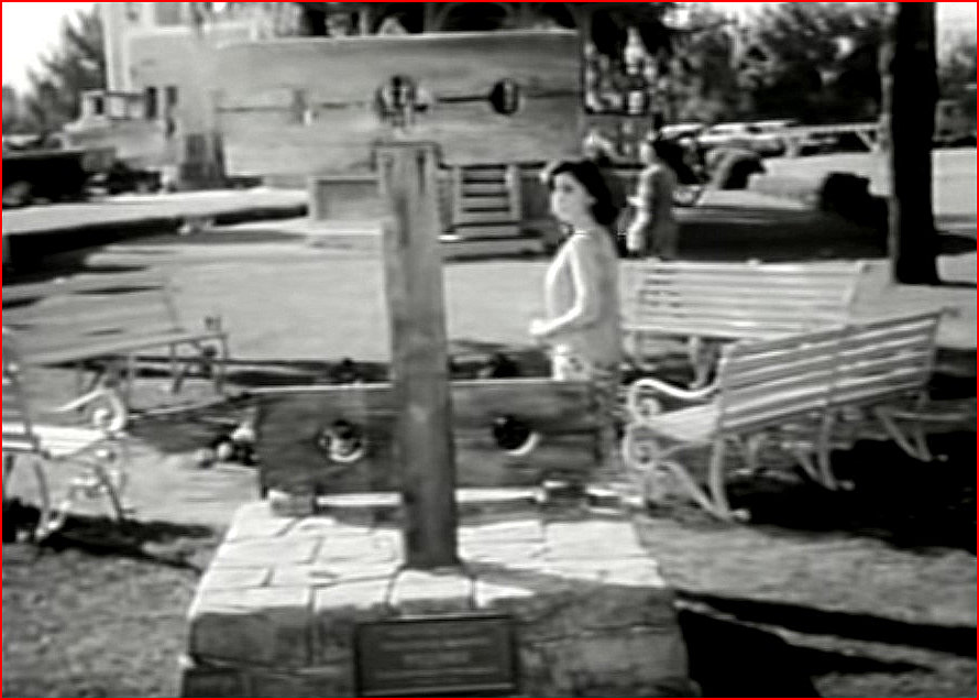 Betty Anderson approaches the Stocks on the Peyton Place Green