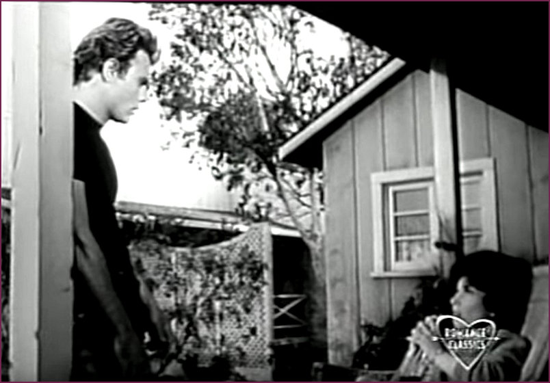 Joe and Stella chat on the porch of the Chernak House