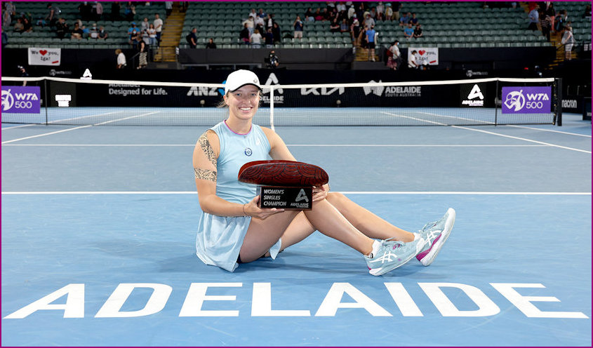 Iga on court with Adelaide International trophy