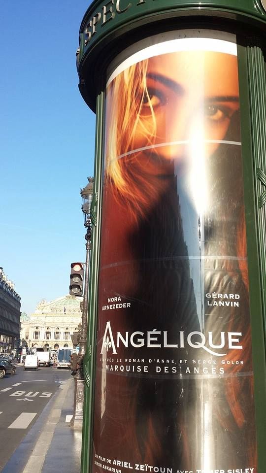 Film Poster in advertising tower near the Opera in Paris