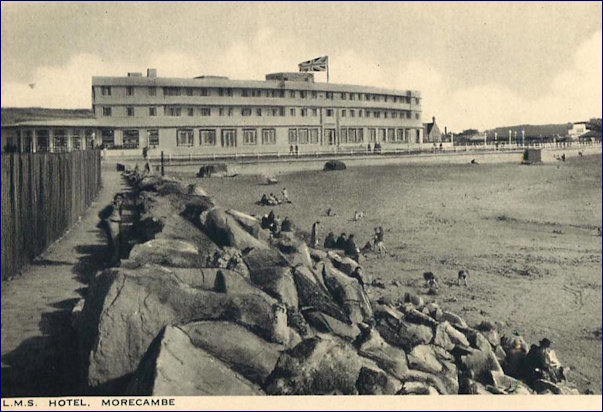 Semi deserted beach behind MH UJ flag flying